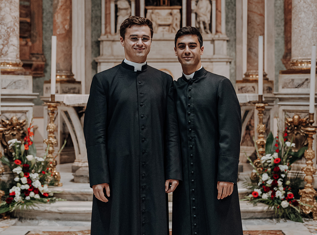 brothers Emmanuel-Marie and Vianney dressed as priests